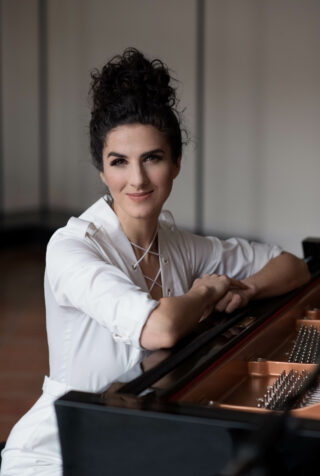 Laila white outfit at piano – Rachel Cicoria